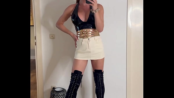 Feeling confident and stylish tonight  A chic black top paired with a light skirt and bold over-the-knee boots – the …