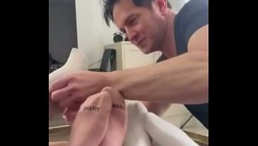 Kirstin, Luna, and Giggi are having fun with their foot slave.