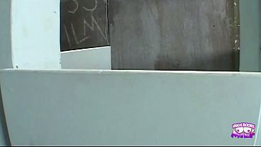 While her man waits in the car the naughty blonde sucks cock in the gloryhole