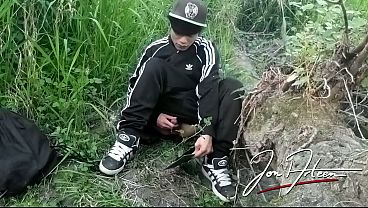 Cute Asian gay twink in a black-and-white adidas tracksuit and Campus sneakers masturbates and cums outdoors